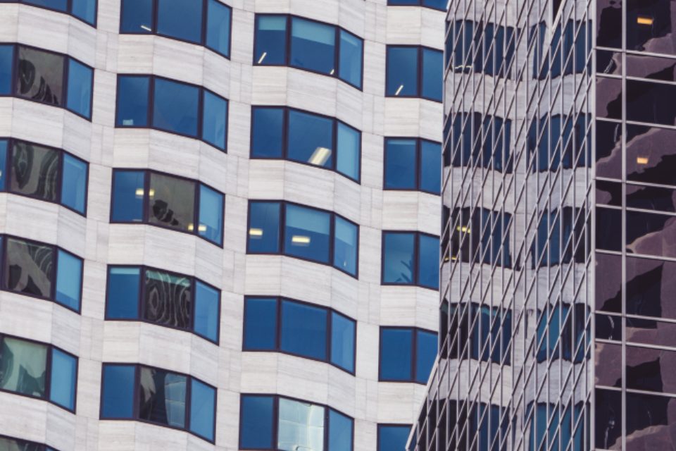 High-rise corporate headquarters seen from street level