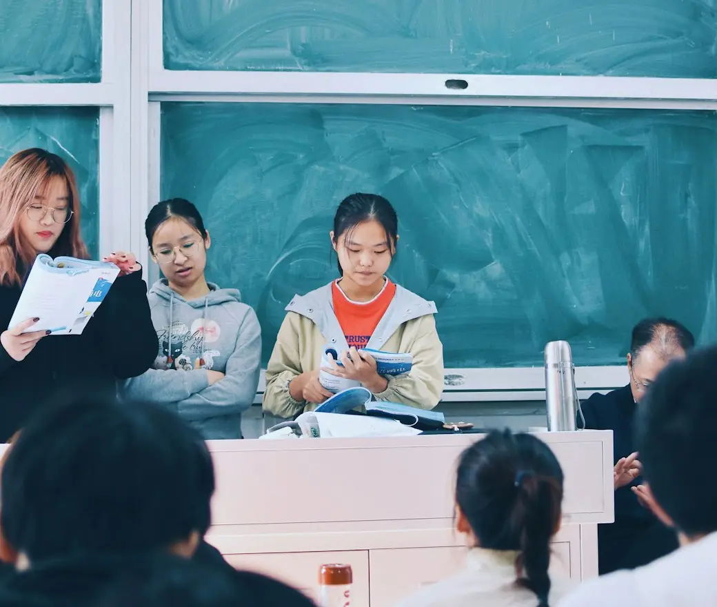 Students working at desks in a classroom