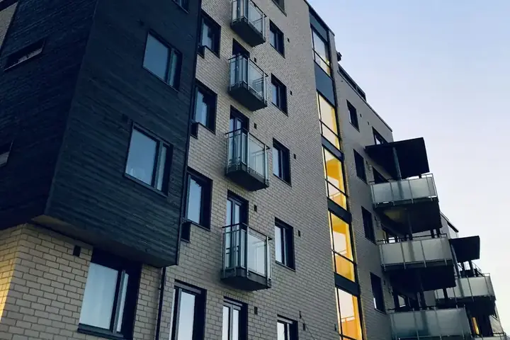 A high-rise apartment building seen from below
